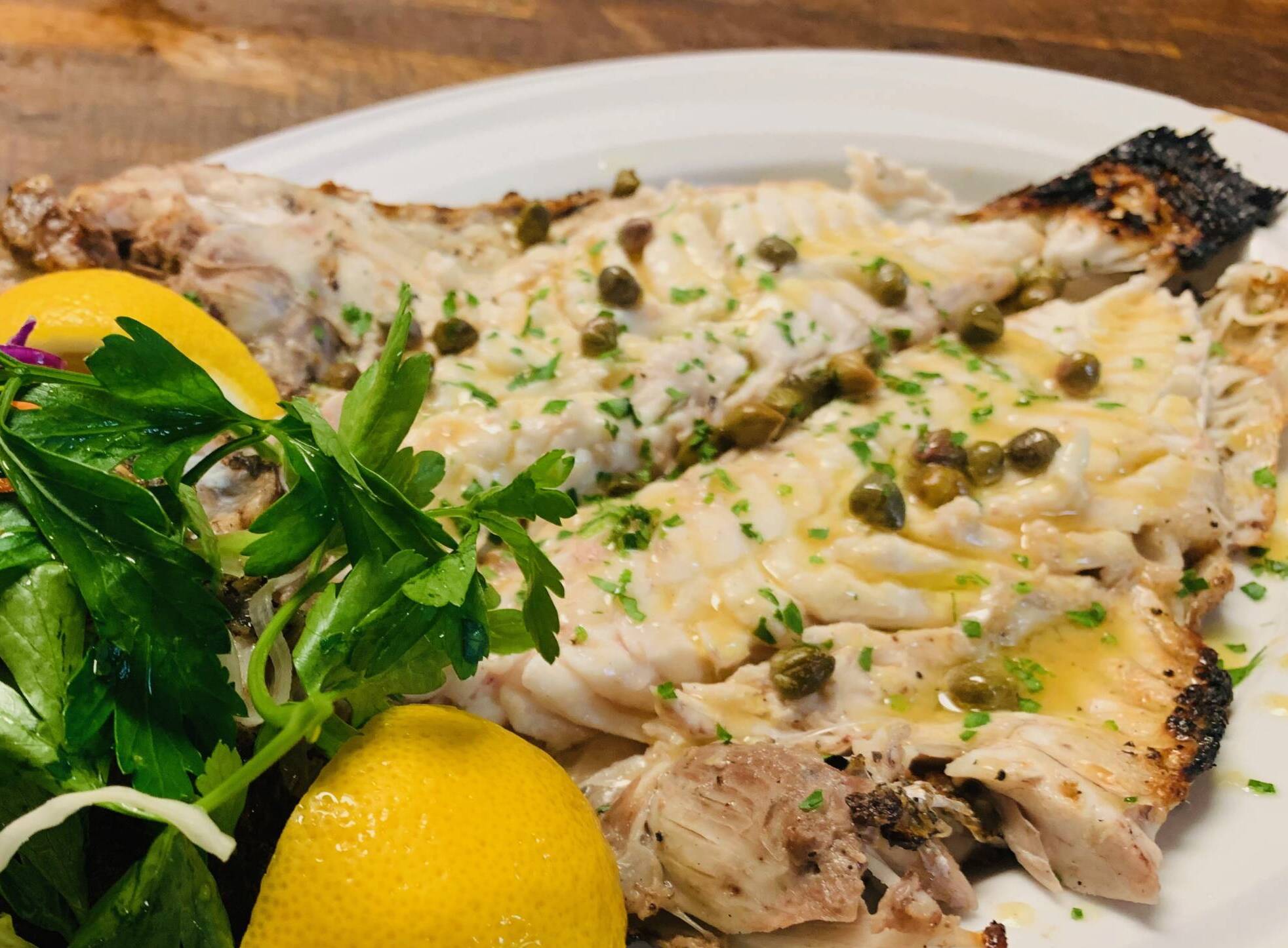 rilled Whole Branzino Served Whole (bone-in) or Filleted (no bone) with mixed greens