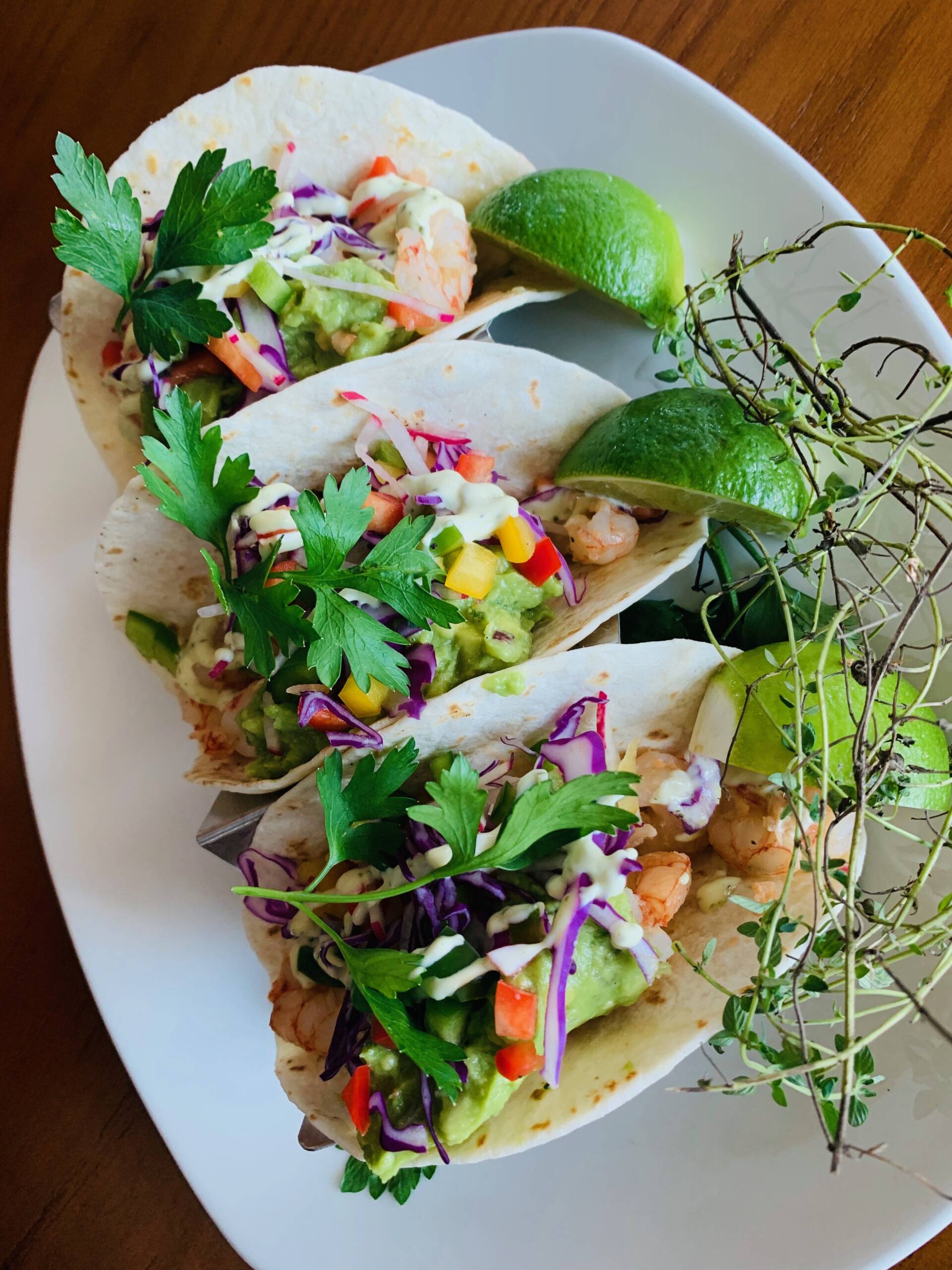 Sauteed Snapper Fish Tacos with Shredded Cabbage, Chipotle Mayo in three Flour Tortillas