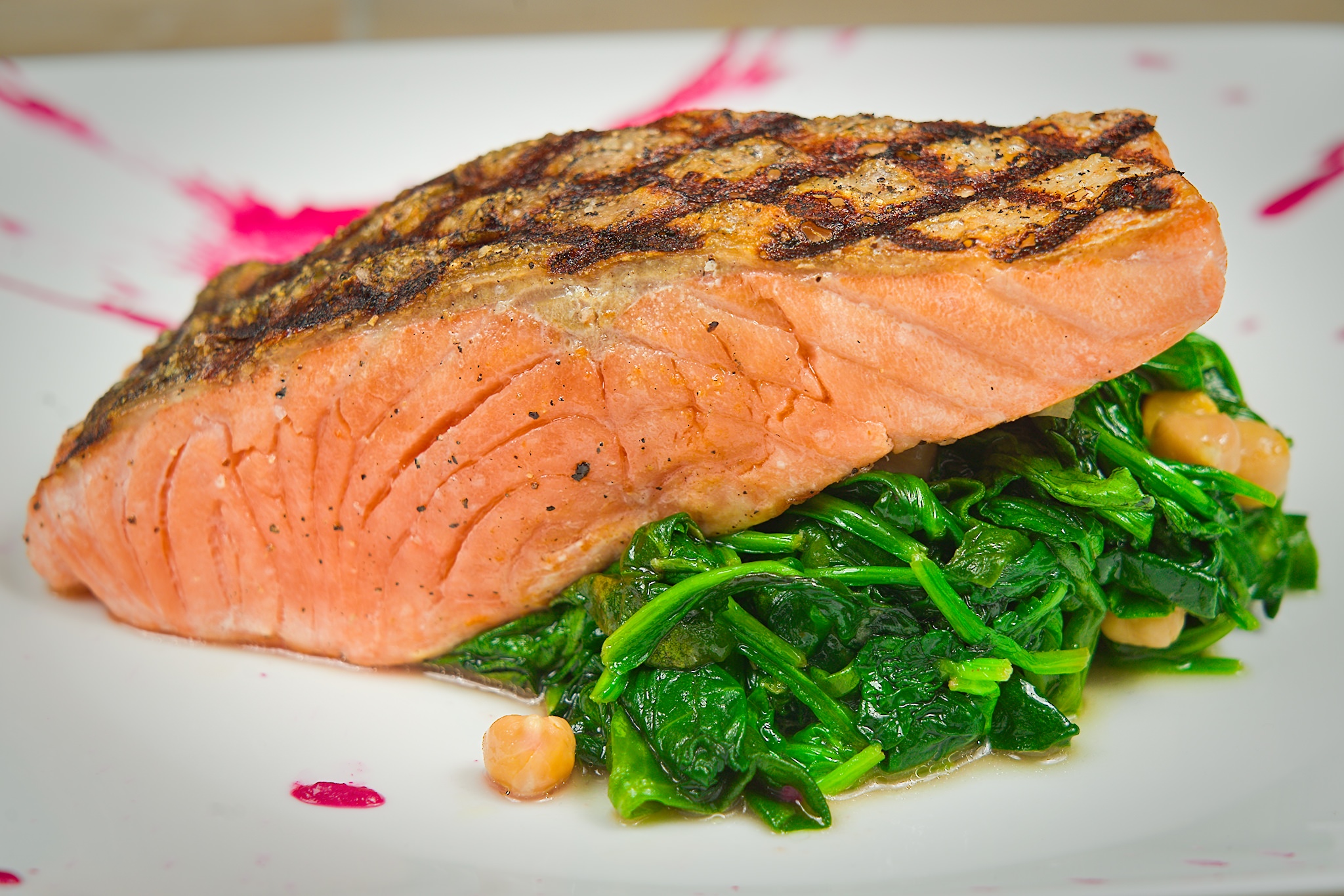 Grilled Faroe Islands Salmon over steamed spinach