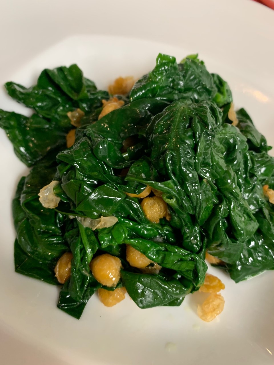 Steamed spinach tossed with extra virgin olive oil and chick peas