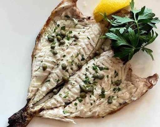 Grilled whole Tsipoura, also known as Sea Bream served bone-in or no bone.